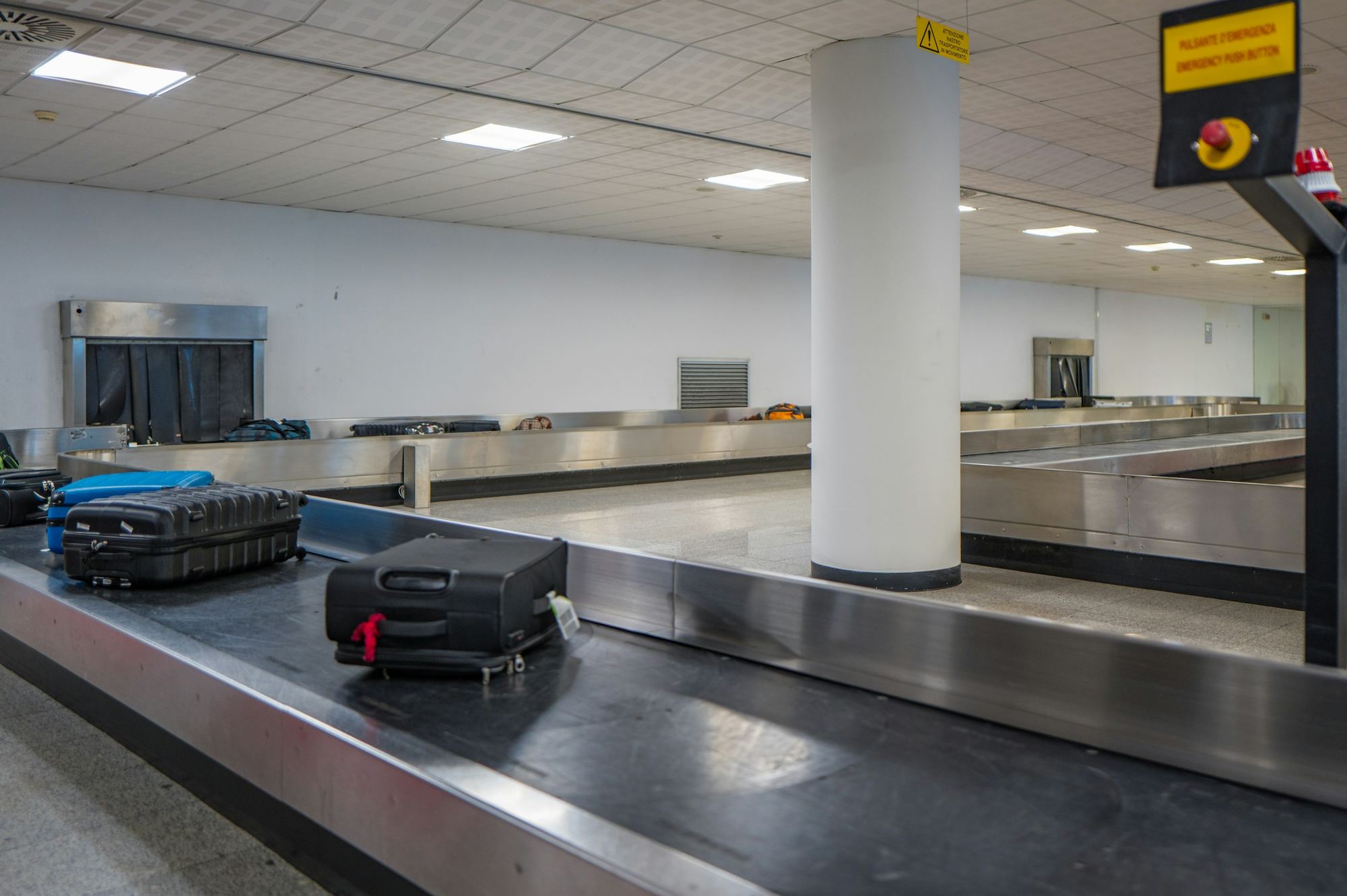 Checked luggage on an airport baggage claim conveyor belt